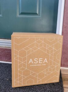 Box of ASEA Redox Supplement on porch